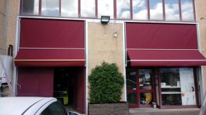 tende a caduta a tinta unita rosse per attività commerciale RIF: TS109